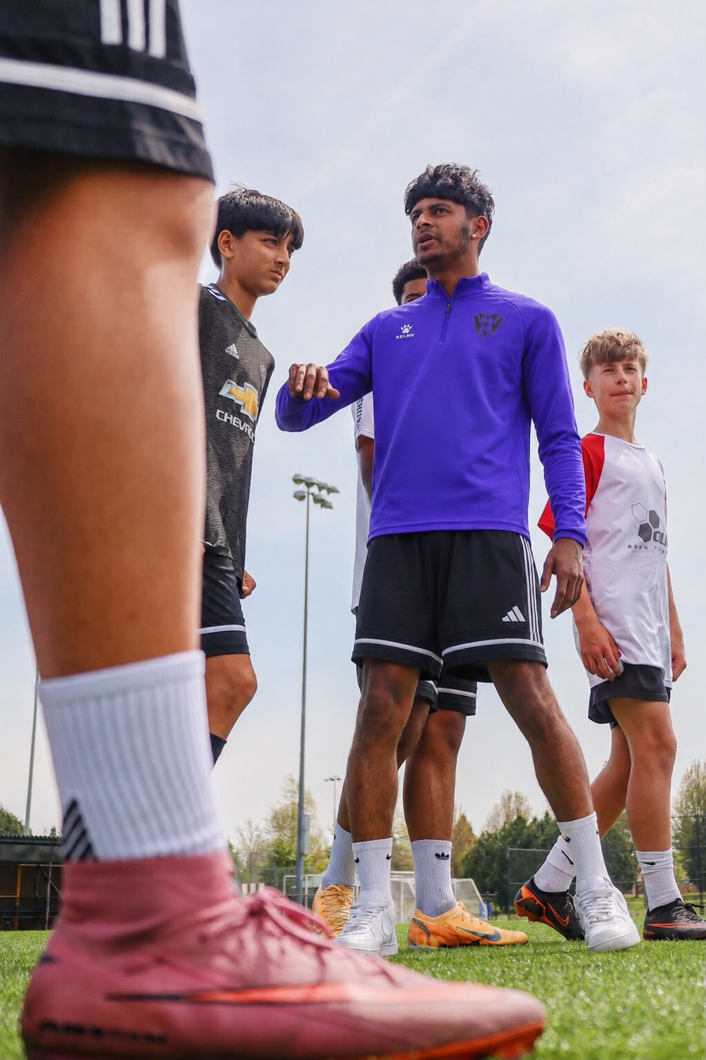Verhoven Next Gen players in purple huddle on the training pitch