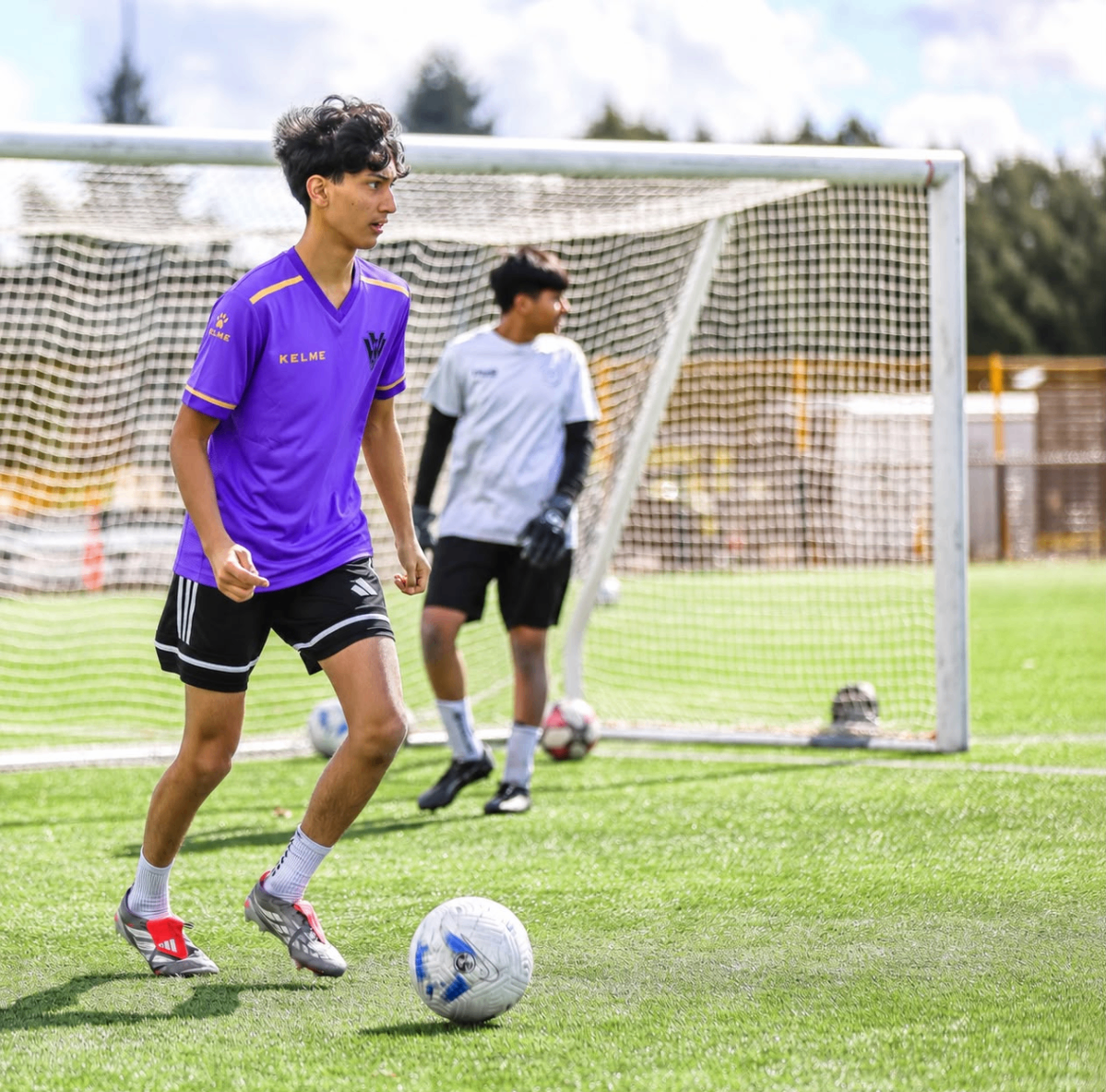 Next Gen player in purple kit working on close control