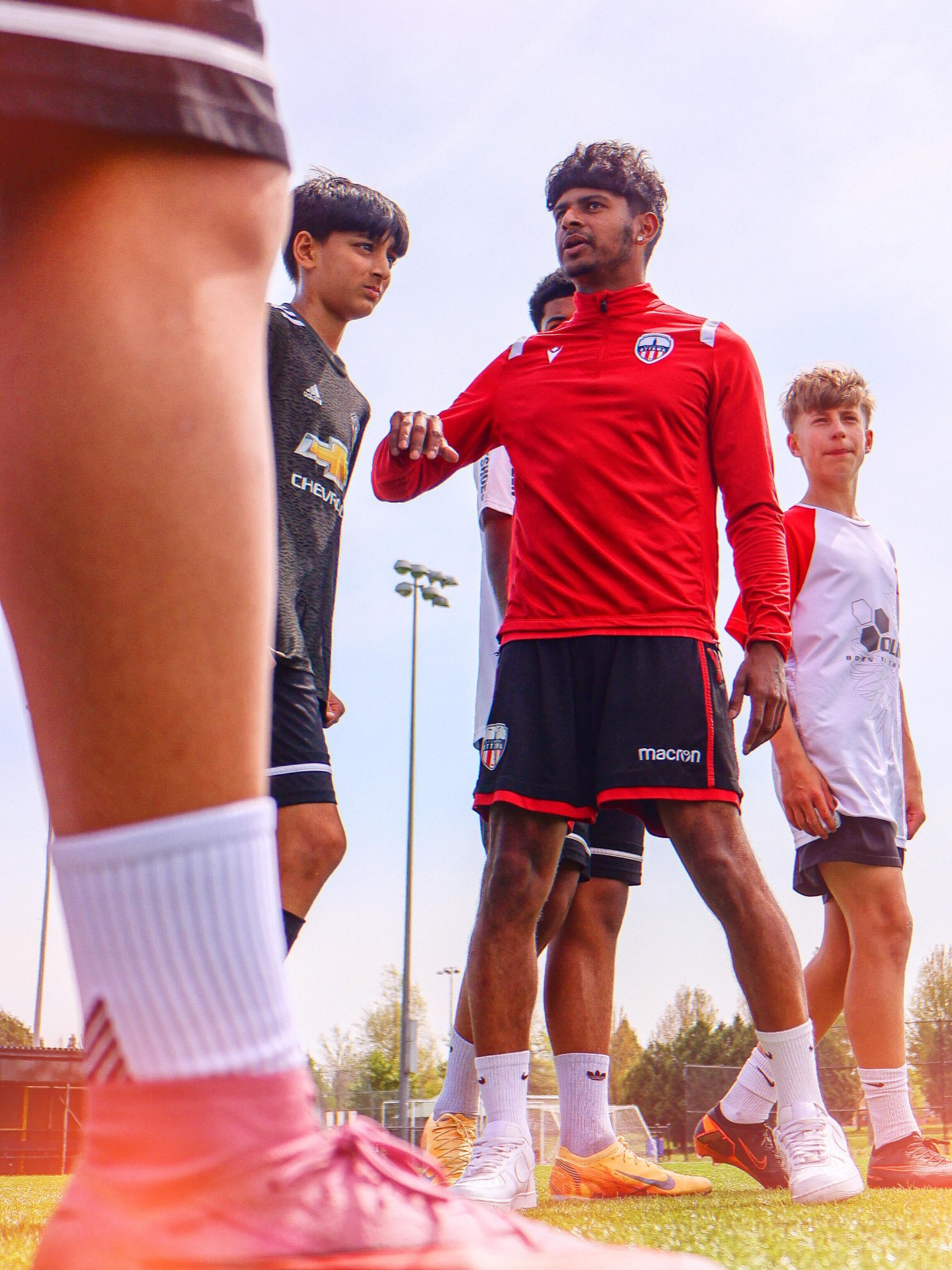Zach Verhoven coaching young footballers